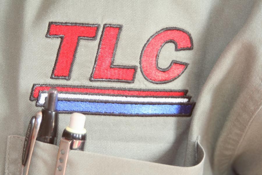 Image of an embroidered TLC logo on a shirt