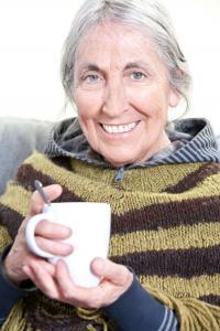Image of an elderly lady with a mug