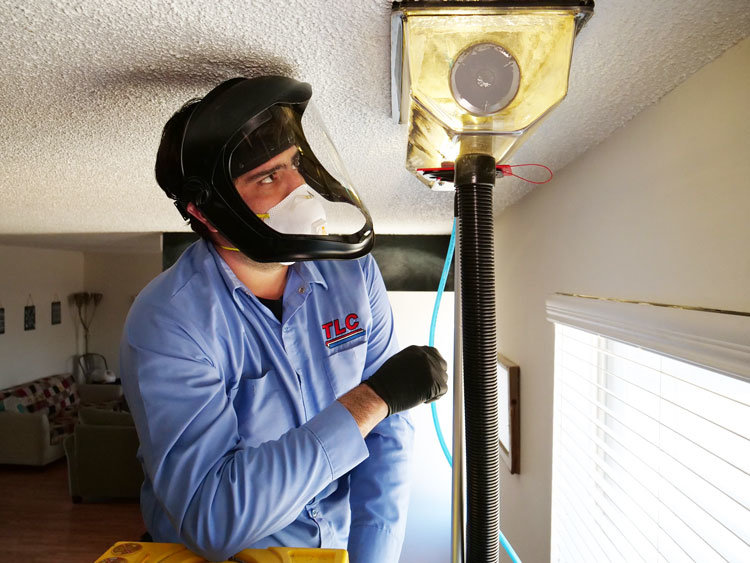 Image of man professionally cleaning a duct