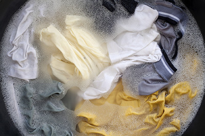 Image of clothes sitting in water soaking