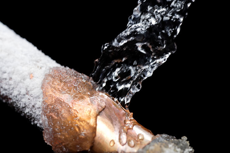 Image of water hitting a frozen pipe for marketing