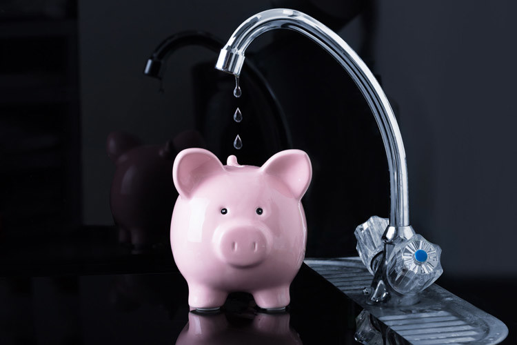 Image of a piggy bank with water dripping