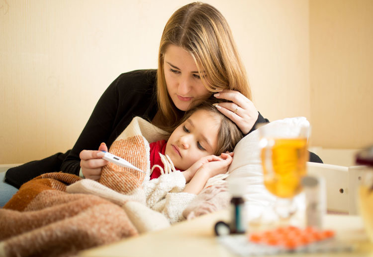 Image of mother holding a sick daughter