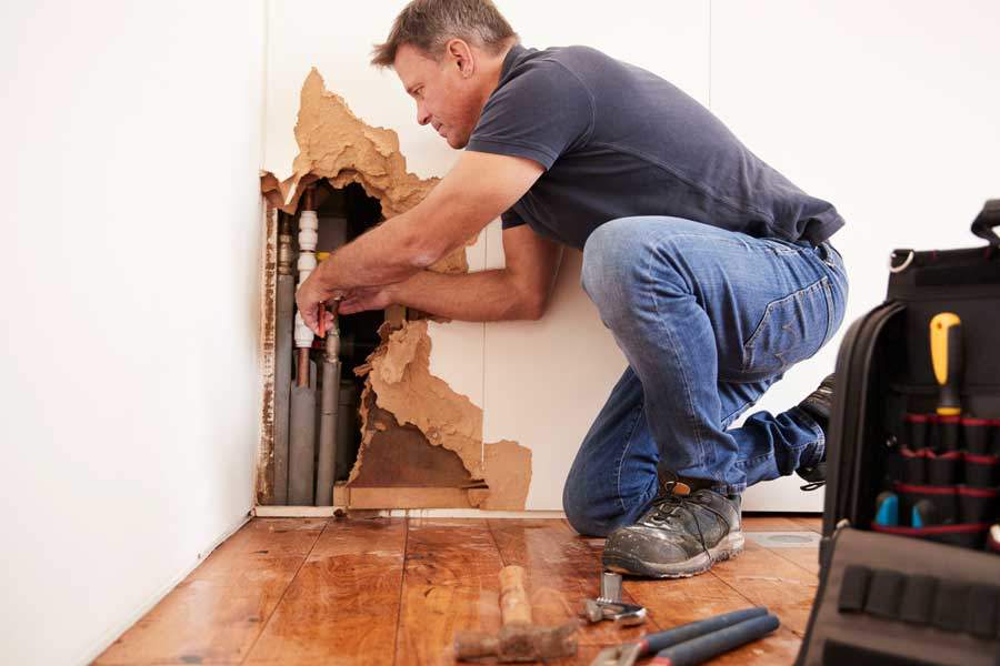 Image of a man working on pipes for marketing