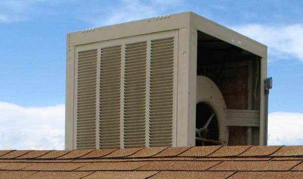 Image of a swamp cooler on a roof with an exposed side for service