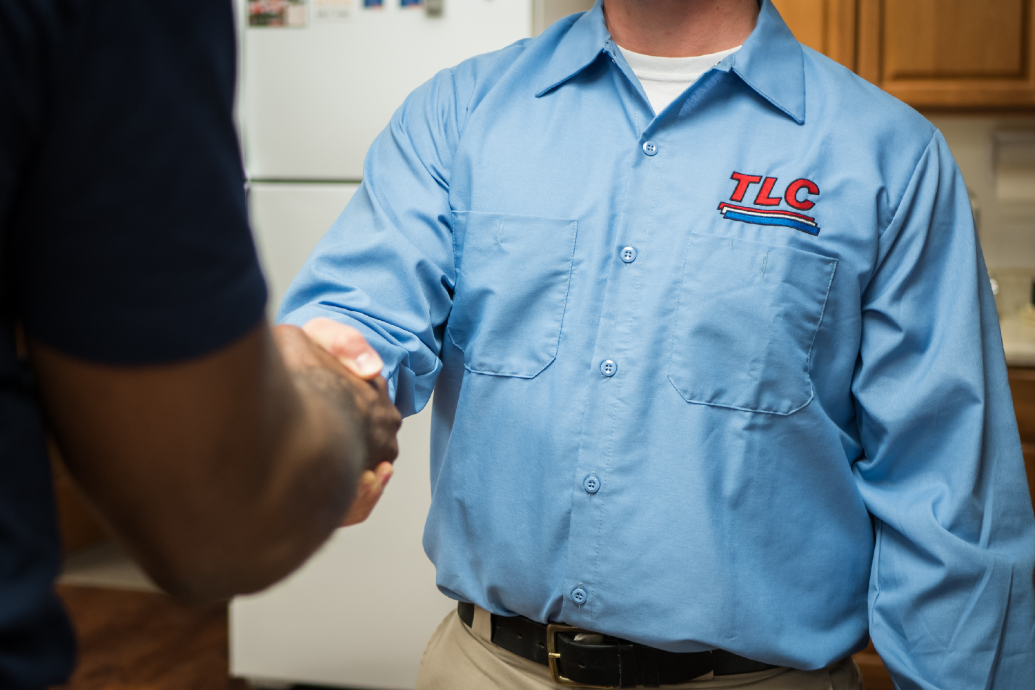 Image of a water heater and professional installer Albuquerque